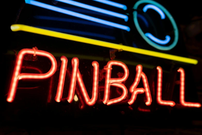 neon sign that says pinball with neon lights