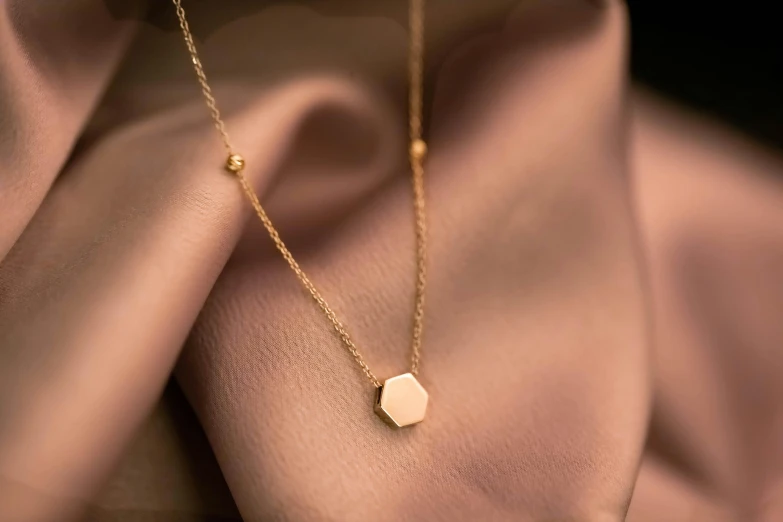 a necklace that has some kind of heart on it