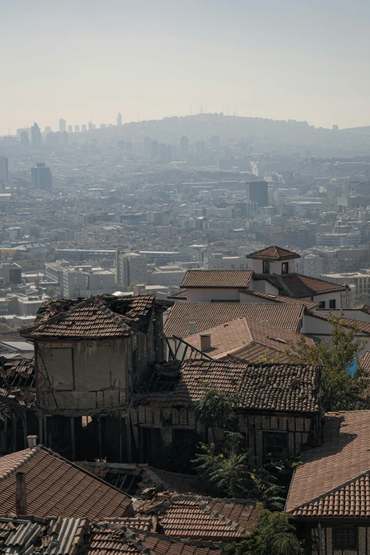 rooftops, houses and mountains near a city