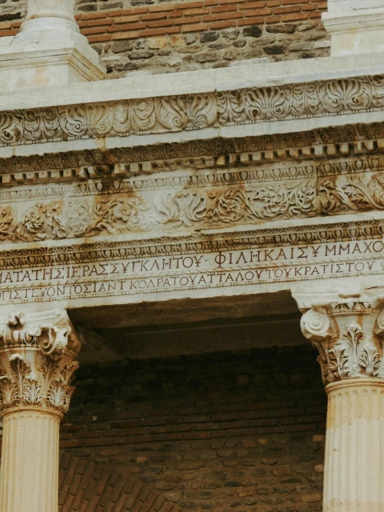 an old building has many greek decoration on the columns