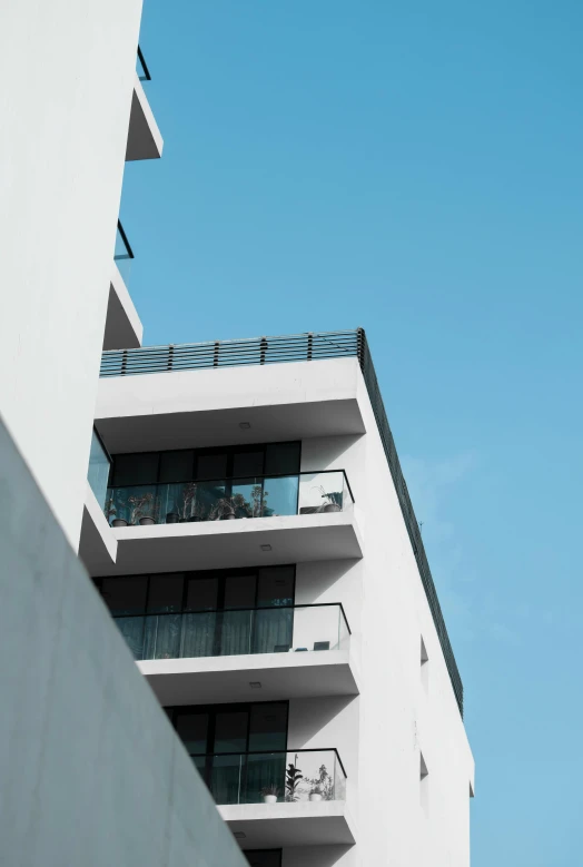 an apartment building with balconies and balconies hanging from the balconies