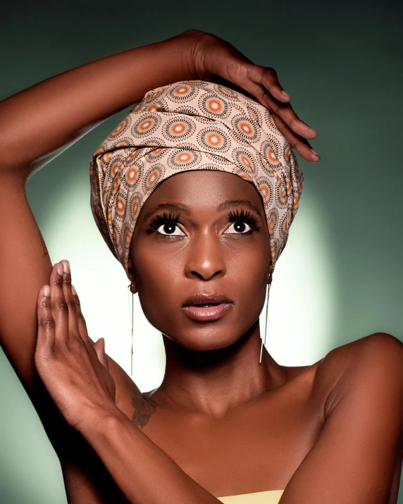 an african american woman wearing a white turban