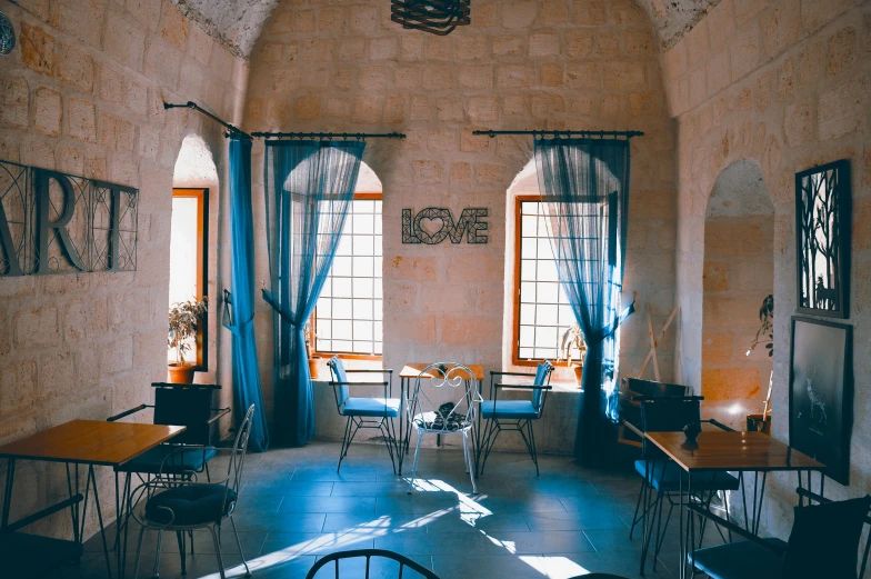 a dining room with two tables and some chairs