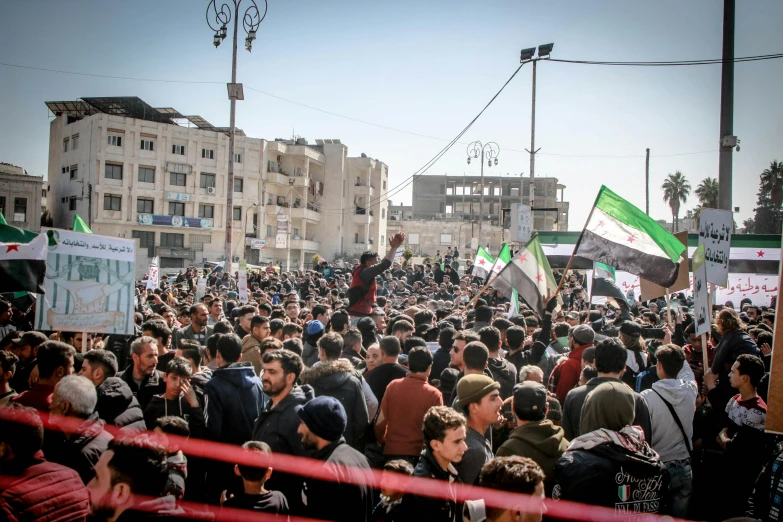 a huge crowd of people on a city street