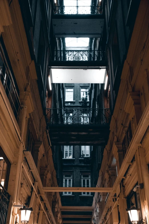 a long narrow hallway with glass ceilinging in the center