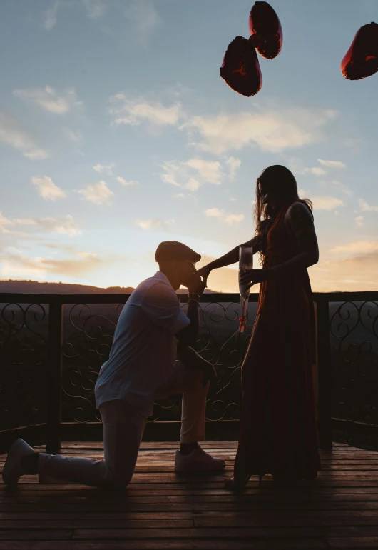 an image of a couple in front of balloons