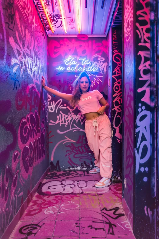 a woman posing in a graffiti alley with purple lights