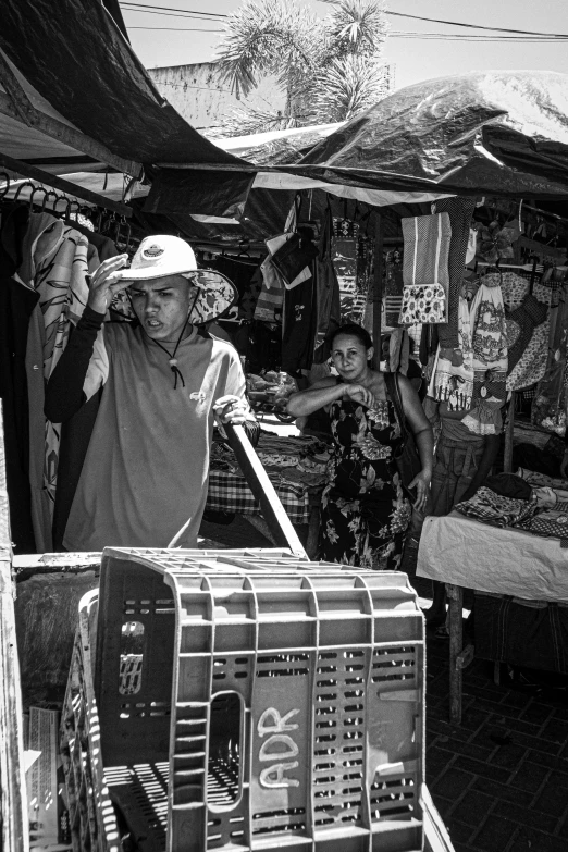 people at a market with a basket full of items