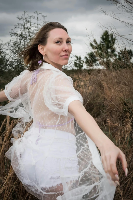 a woman wearing an unusual looking dress and a headpiece