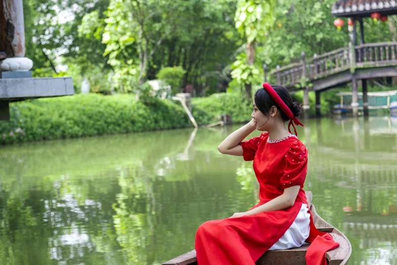 a young woman is in a boat while floating