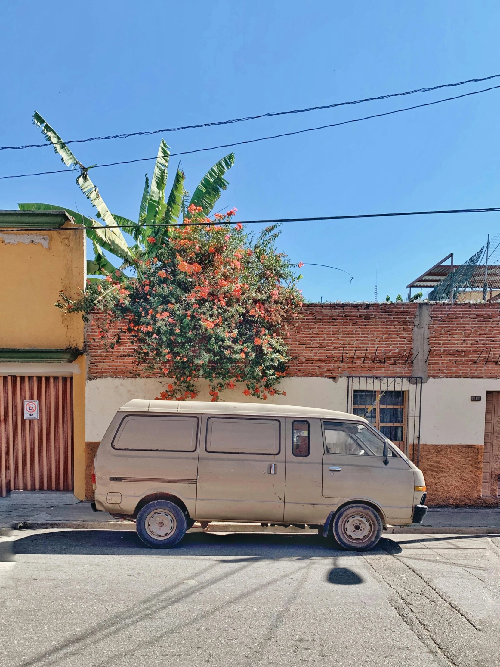 a van parked on the street in front of a building