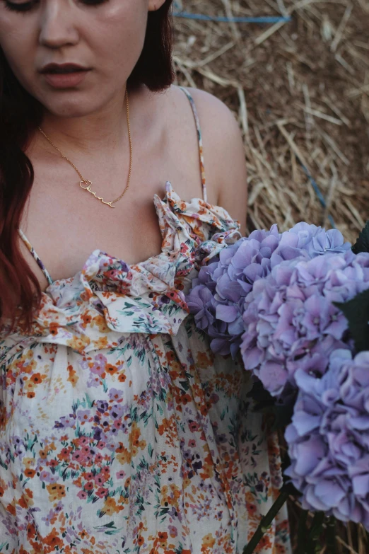 an image of a woman that is holding some flowers