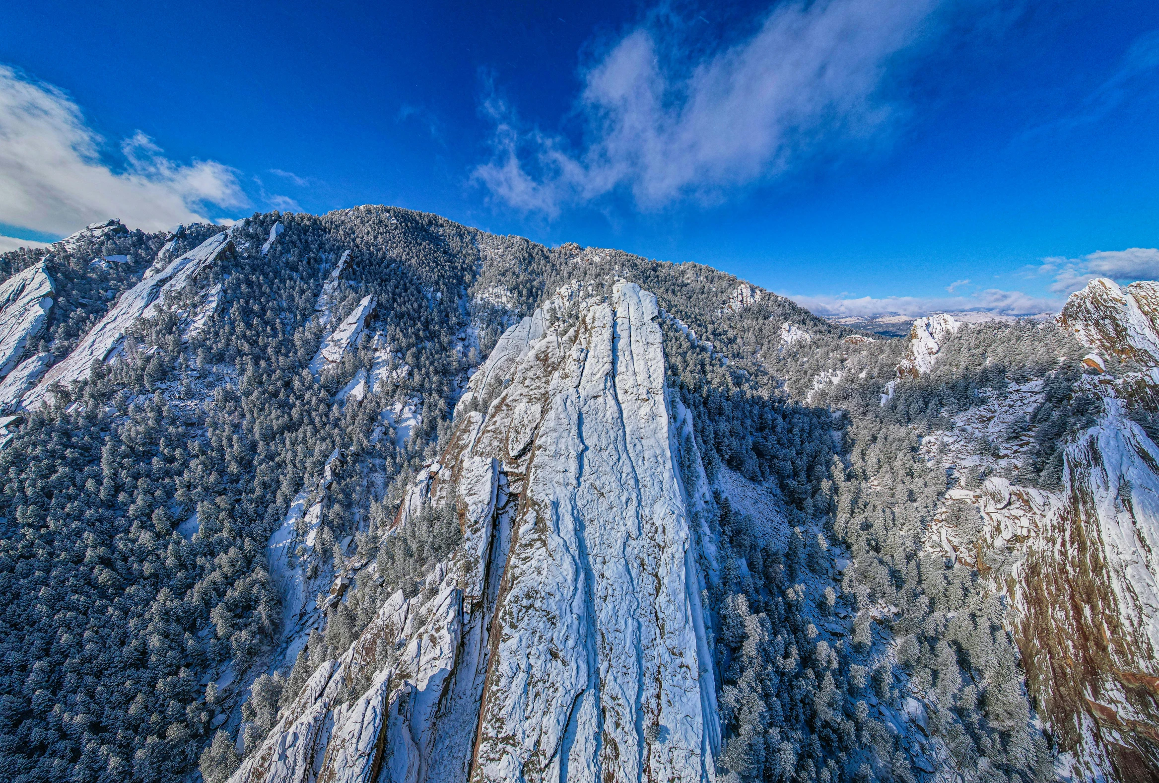 a very tall mountain that is covered in snow