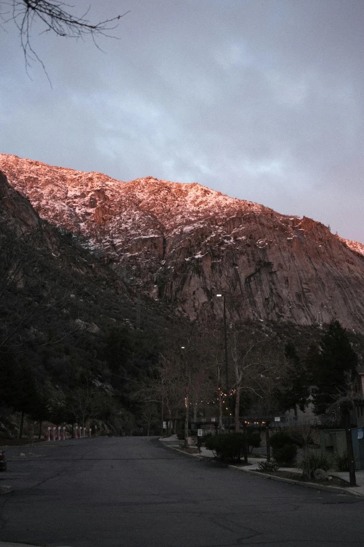 a snowy mountain range behind a town