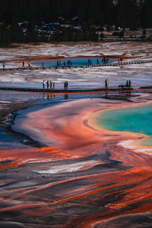 people are standing at the edge of a geometological area in nature