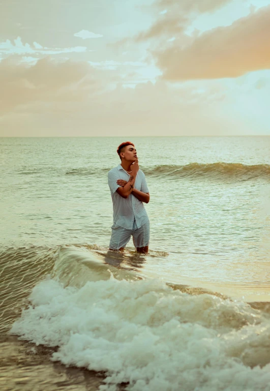 a man in the ocean water clapping