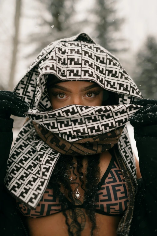 a person with a hat and scarf on