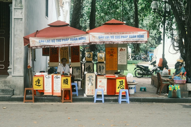 an asian store with red and white umbrellas