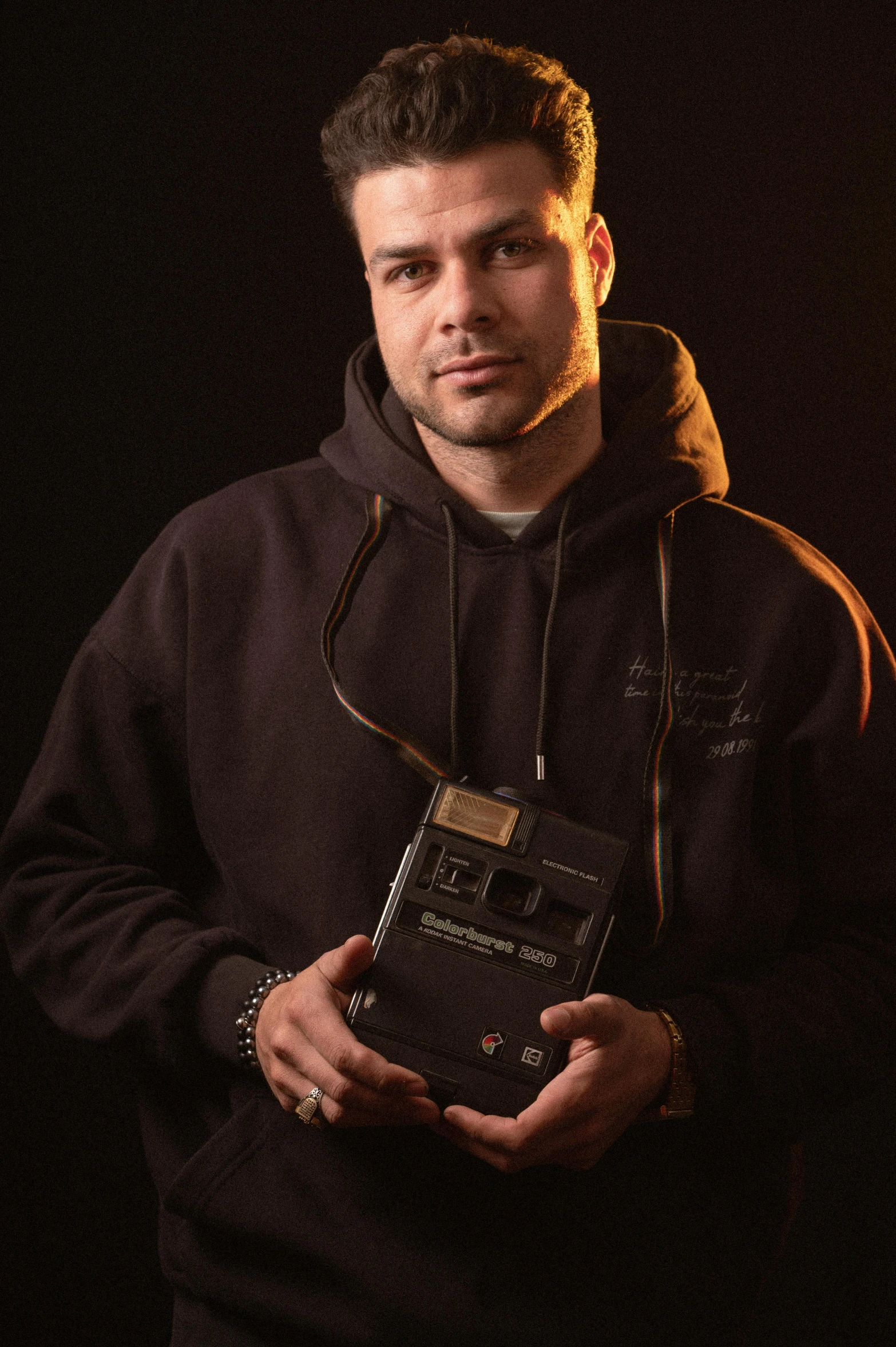 a man is holding a plaque in his hands