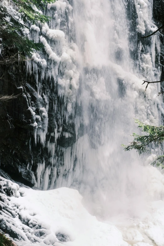 water spewing out of the waterfall wall