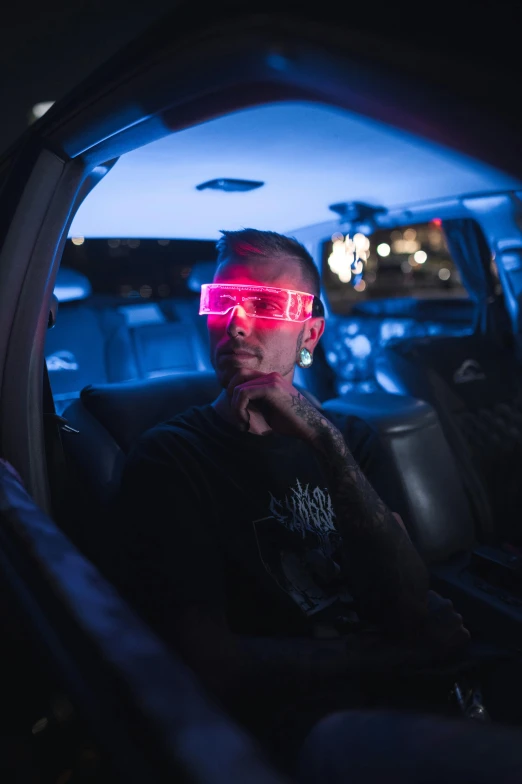 a man with pink shades and a neon sunglasses