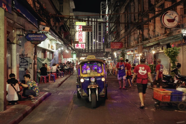 a bus is driving through a busy street in asia