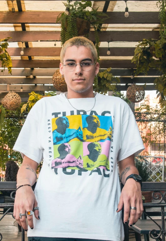 young man with sunglasses on with white tshirt