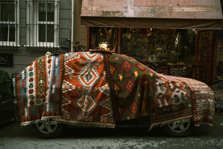a covered car on the side of a road