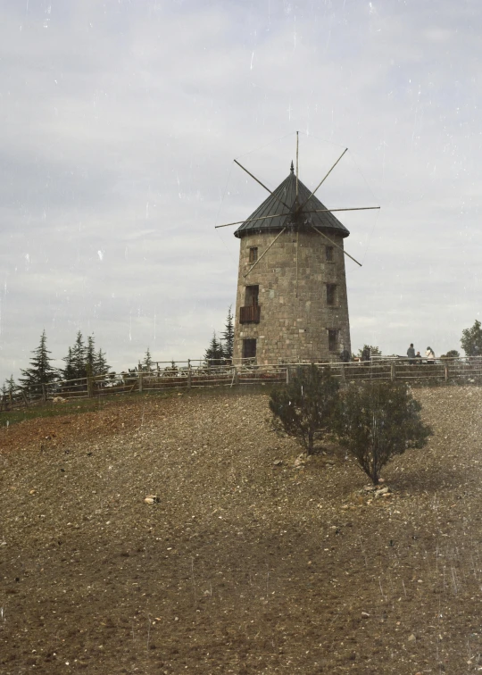 a wind mill on top of a hill