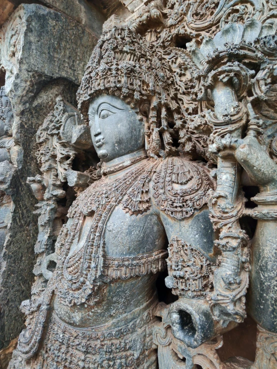 stone carvings depicting two women in ornate clothing