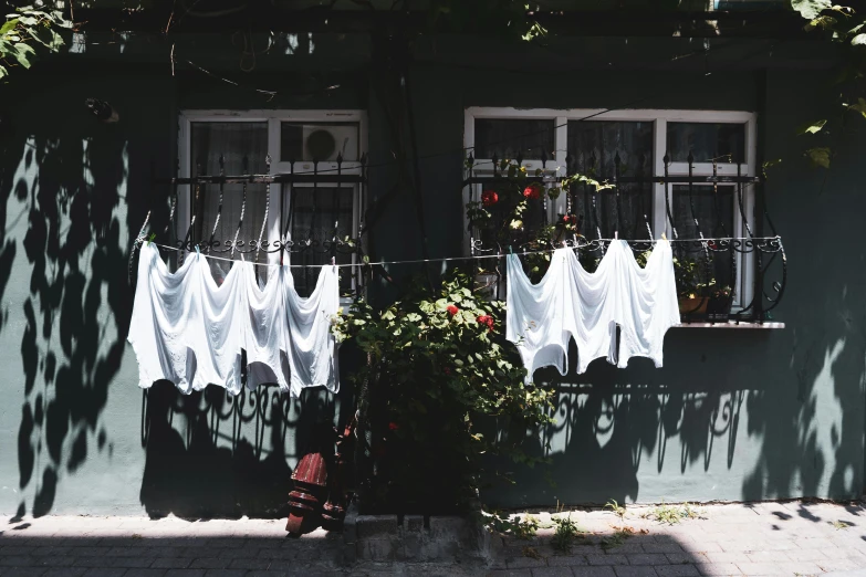 clothes hanging on a line outside a building