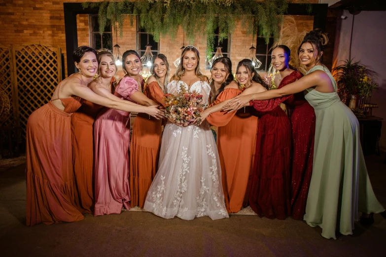 a group of women standing in a room together