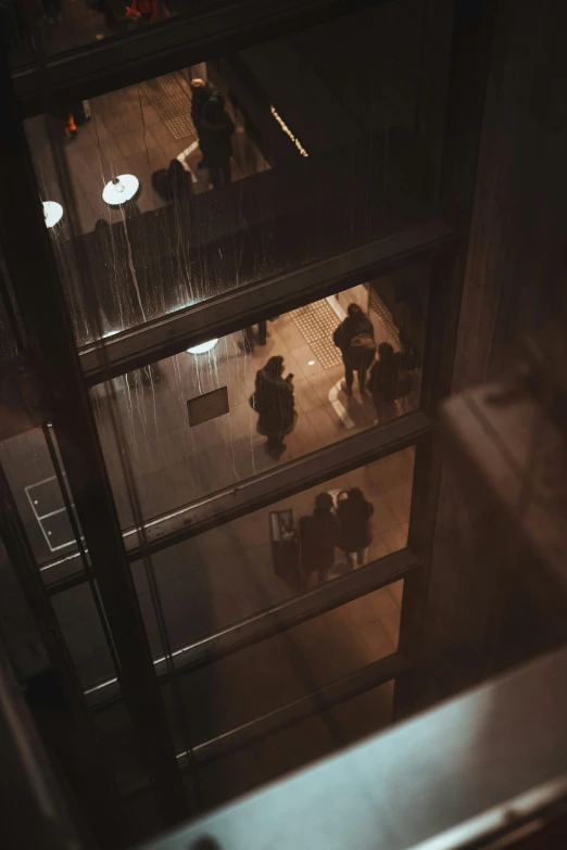 two people in business suits sitting in an office building