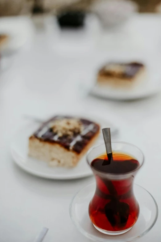 a plate with desert and a glass of tea