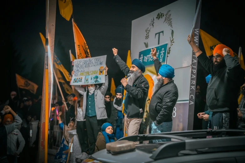 a group of people who are holding up flags