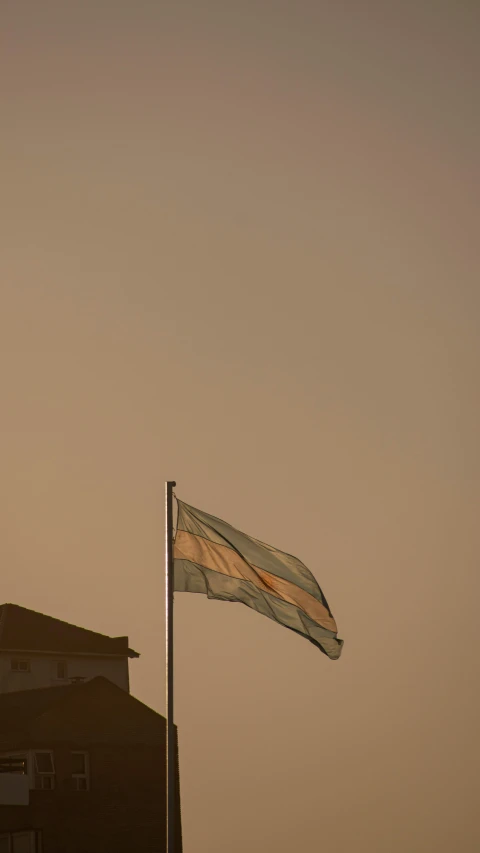 a flag is being flown at an open air venue