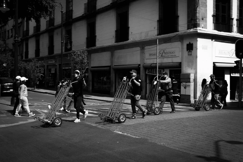 the men walk down the street with their equipment