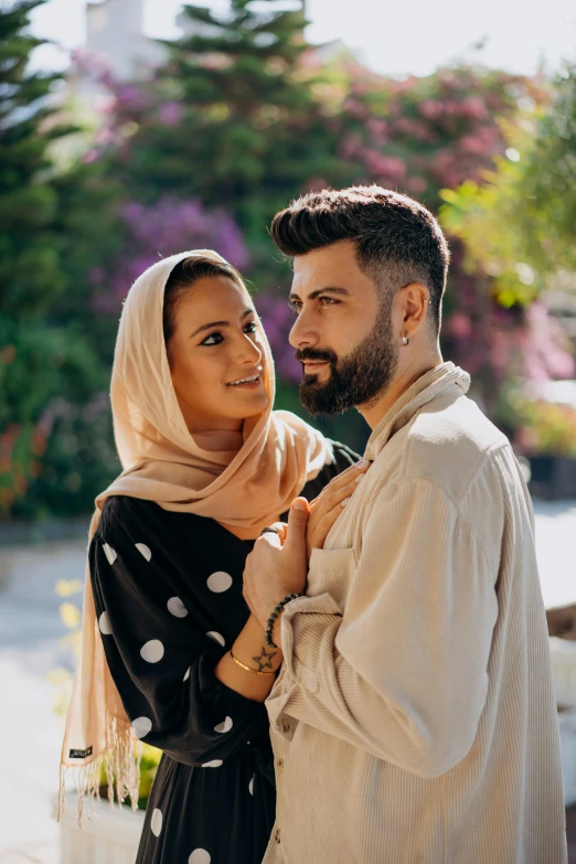 the man and woman are posing for a picture