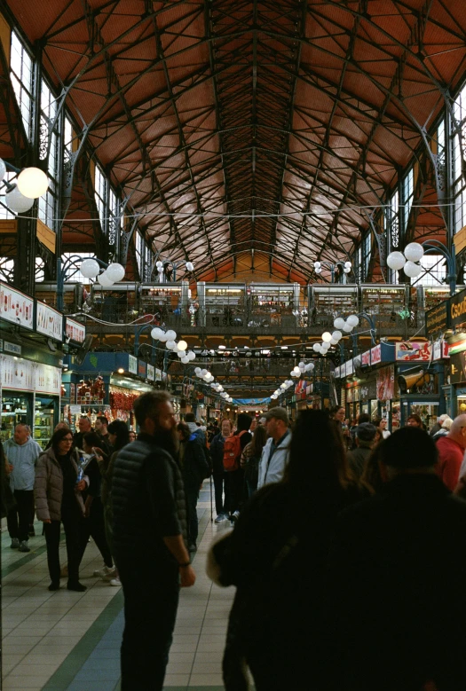 inside a building covered by large arched ceilings