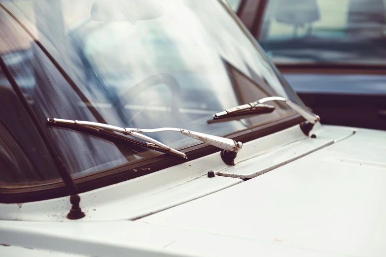 a pair of glasses are resting on the hood of a car