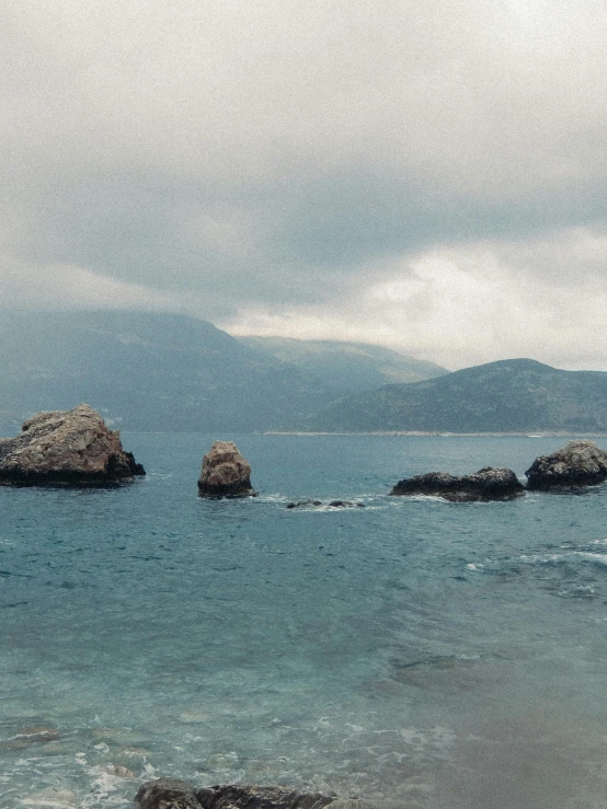 a picture of a rock formation on the beach