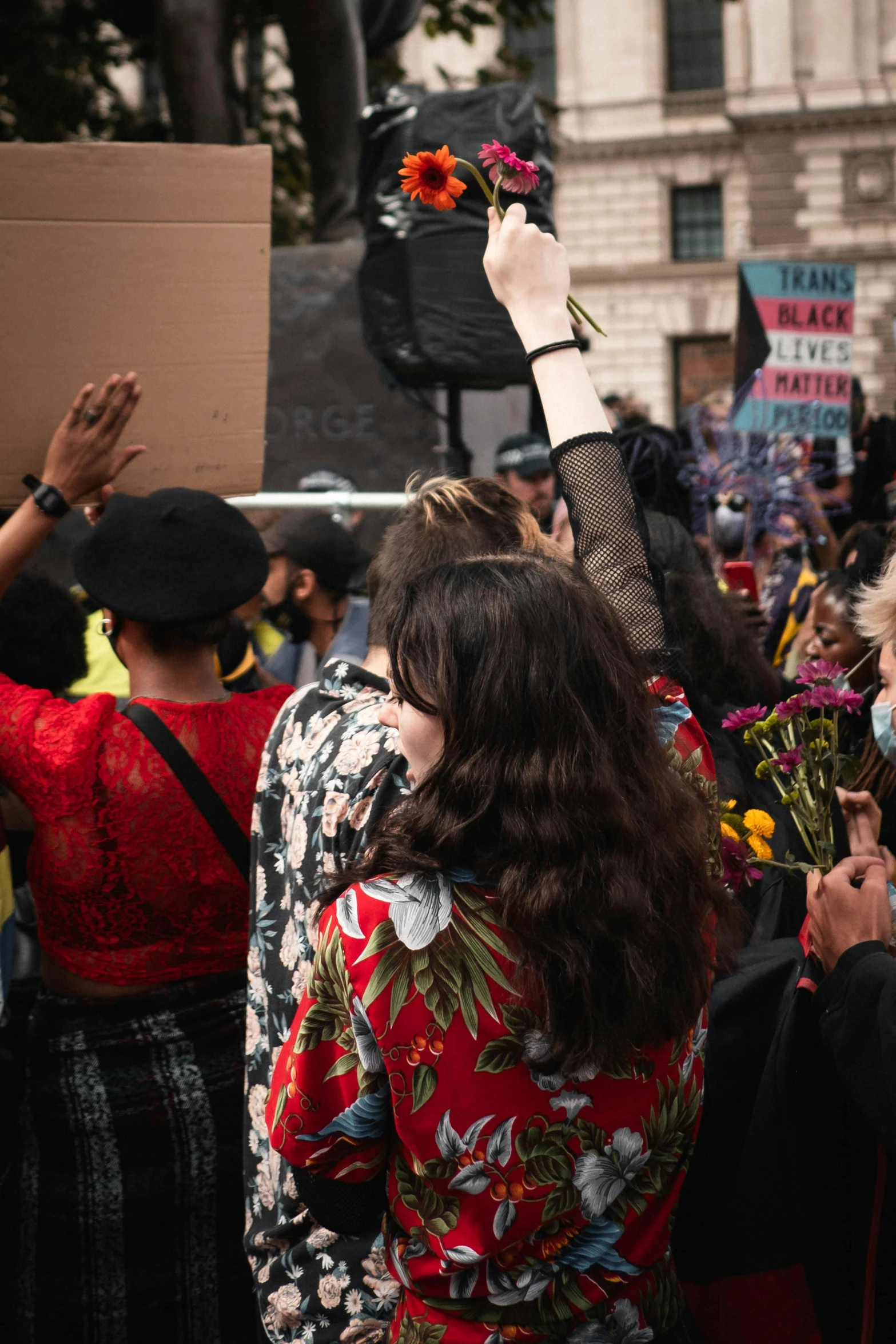 a crowd of people are gathered outside wearing hats