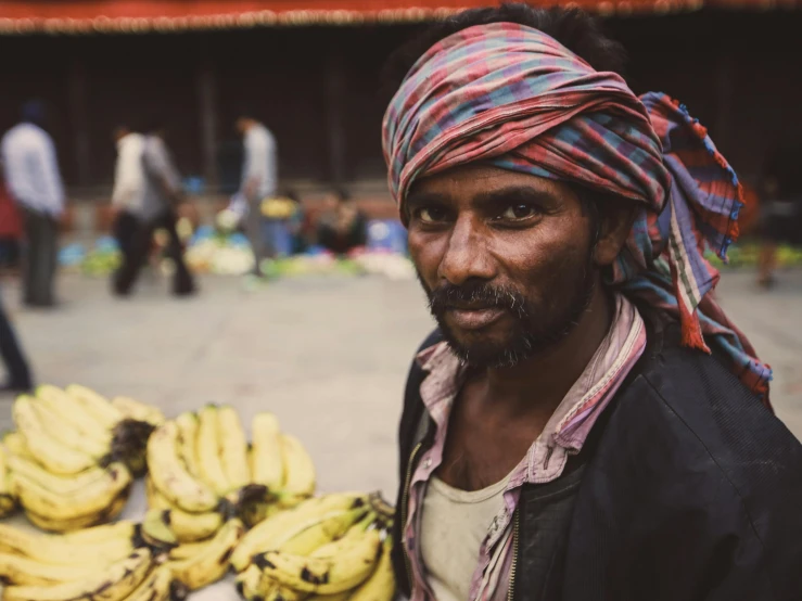 a man with a large number of bananas