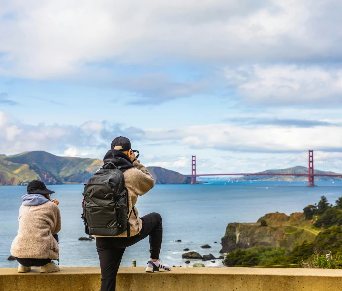 two people looking at the view of the golden gate bridge