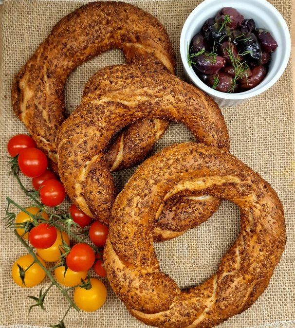 a bunch of onion rings sitting on a table next to small bowls of vegetables