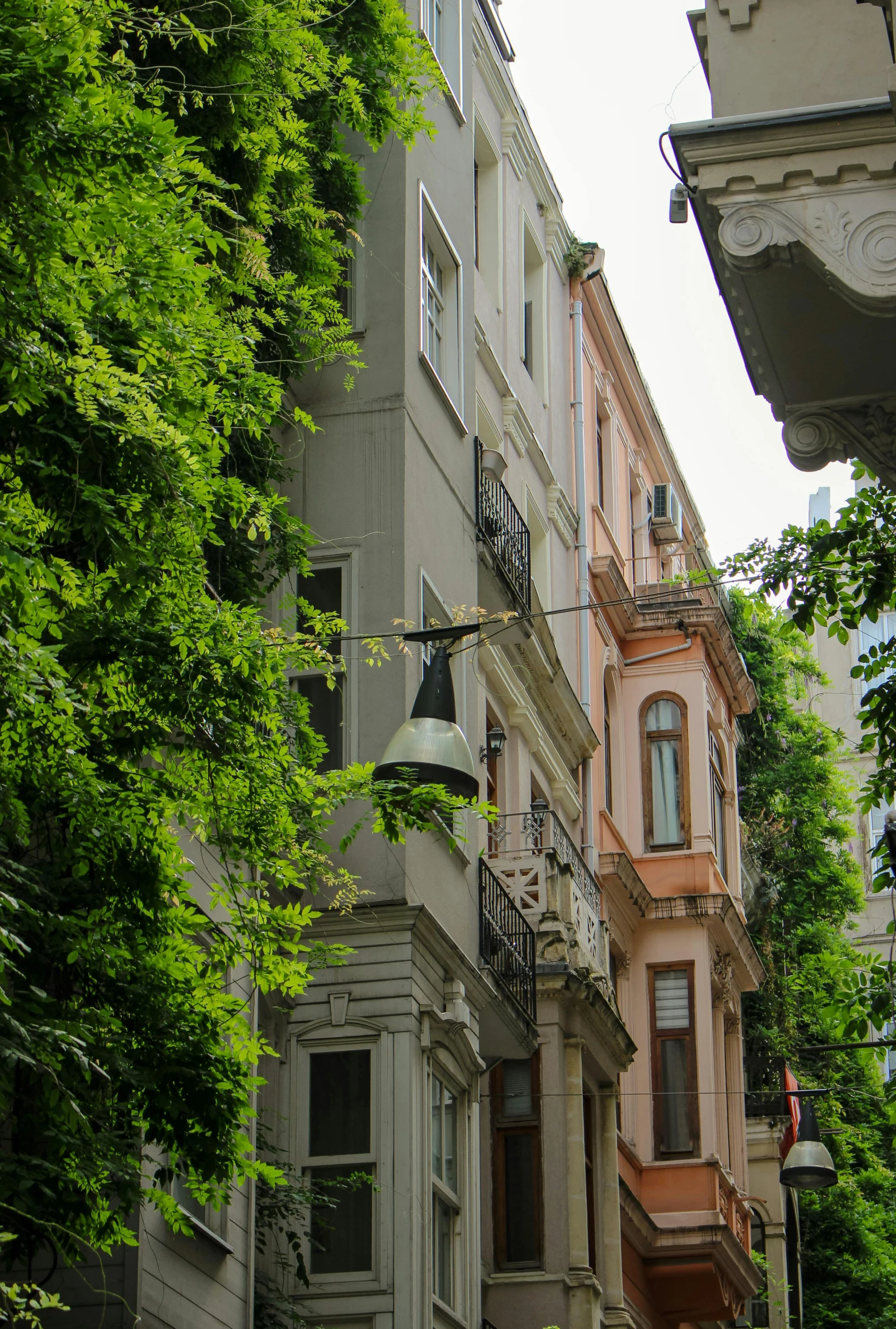 the street has many different old style apartment buildings