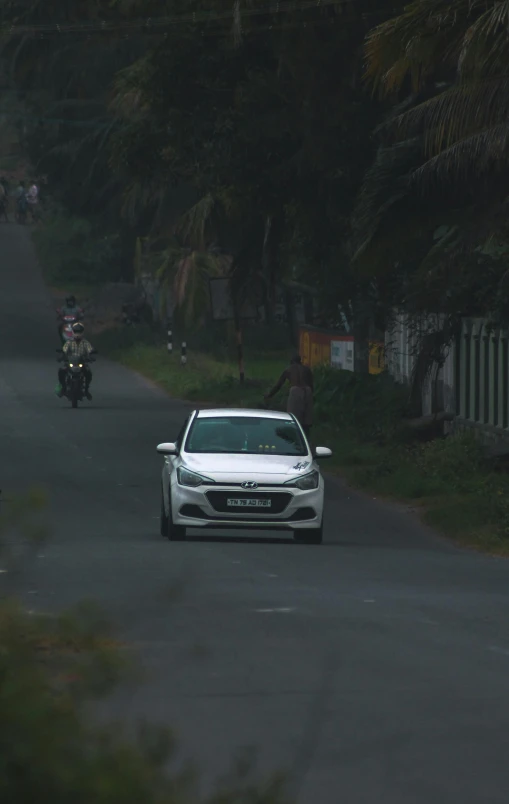 there are many cars driving down the road together