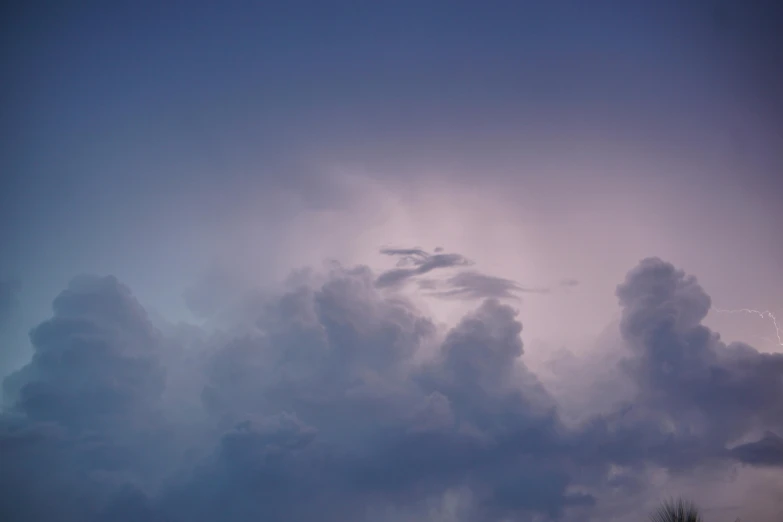 a cloudy view from the top of an airplane