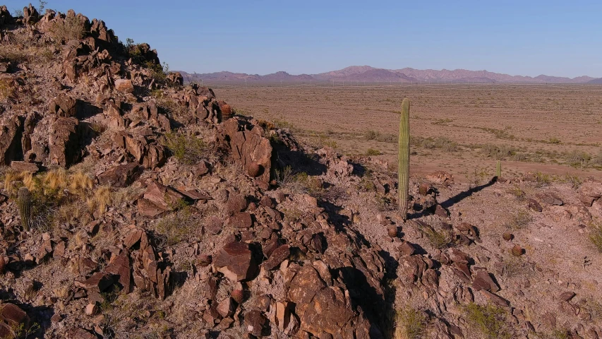 desert scene of desert with rock formations and small cactus