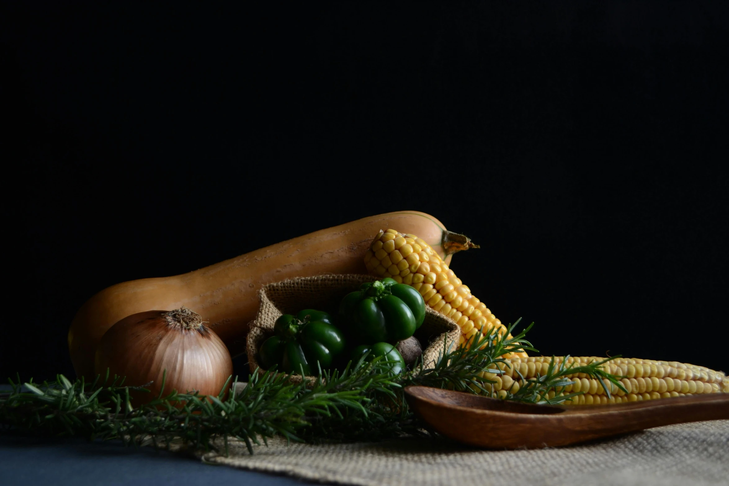 the table has corn and vegetables in it